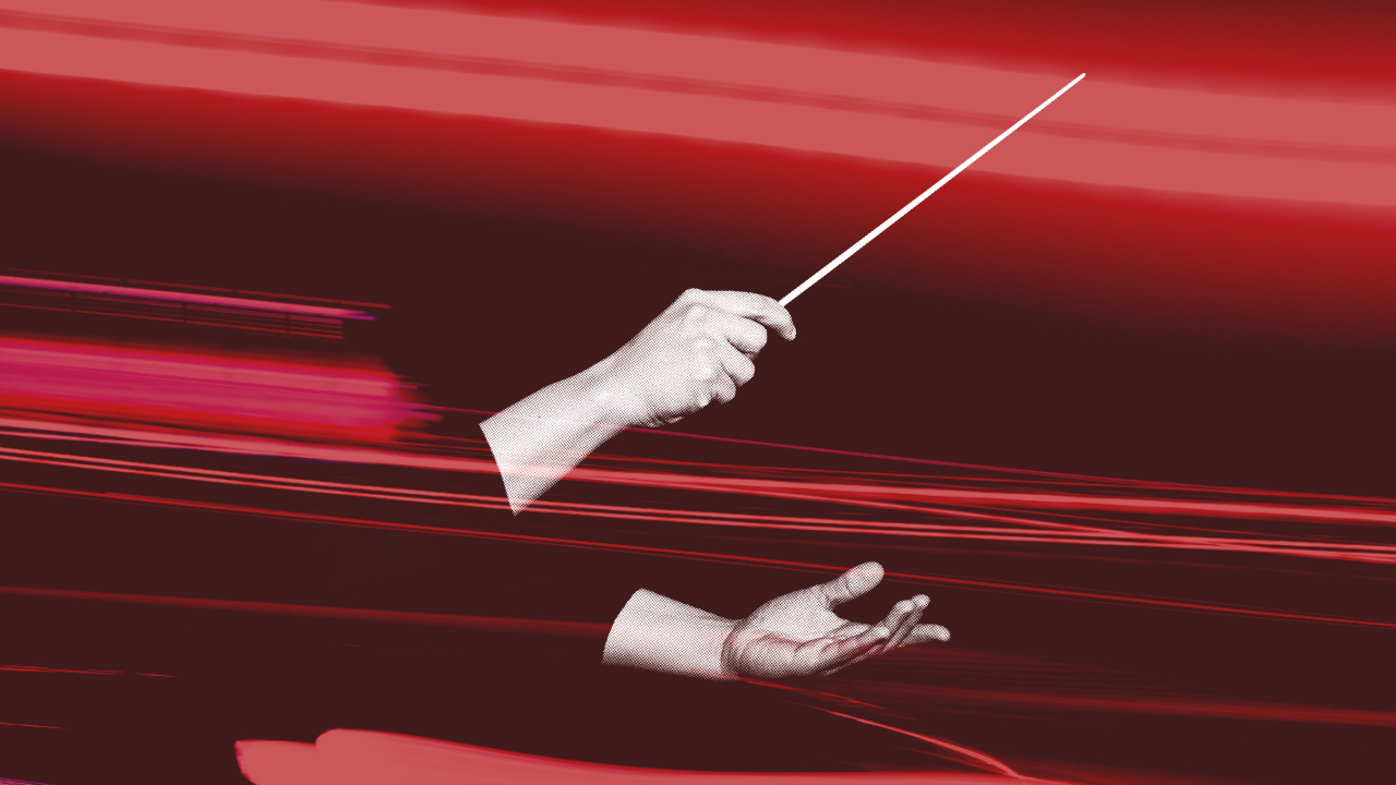 A digitally edited image showing a conductor’s hands, one holding a baton, against a red background with motion blur and light streaks.