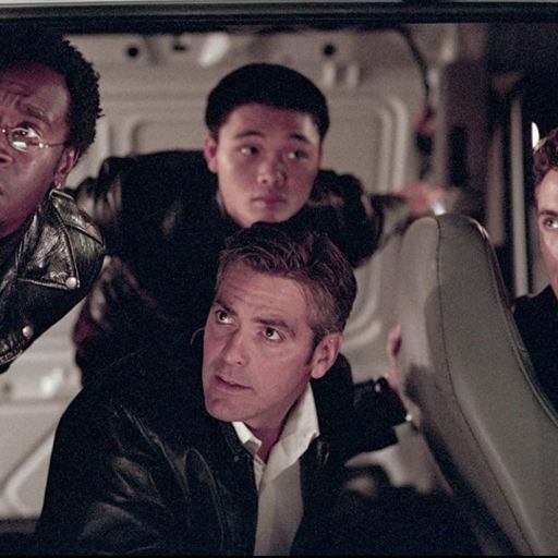 Don Cheadle, George Clooney, Shaobo Qin, and Casey Affleck in a scene from 2001's Ocean's Eleven.