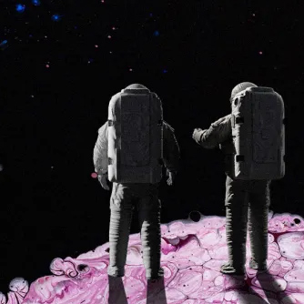 Two astronauts in spacesuits stand on a pink, marbled surface, facing the dark starry sky.