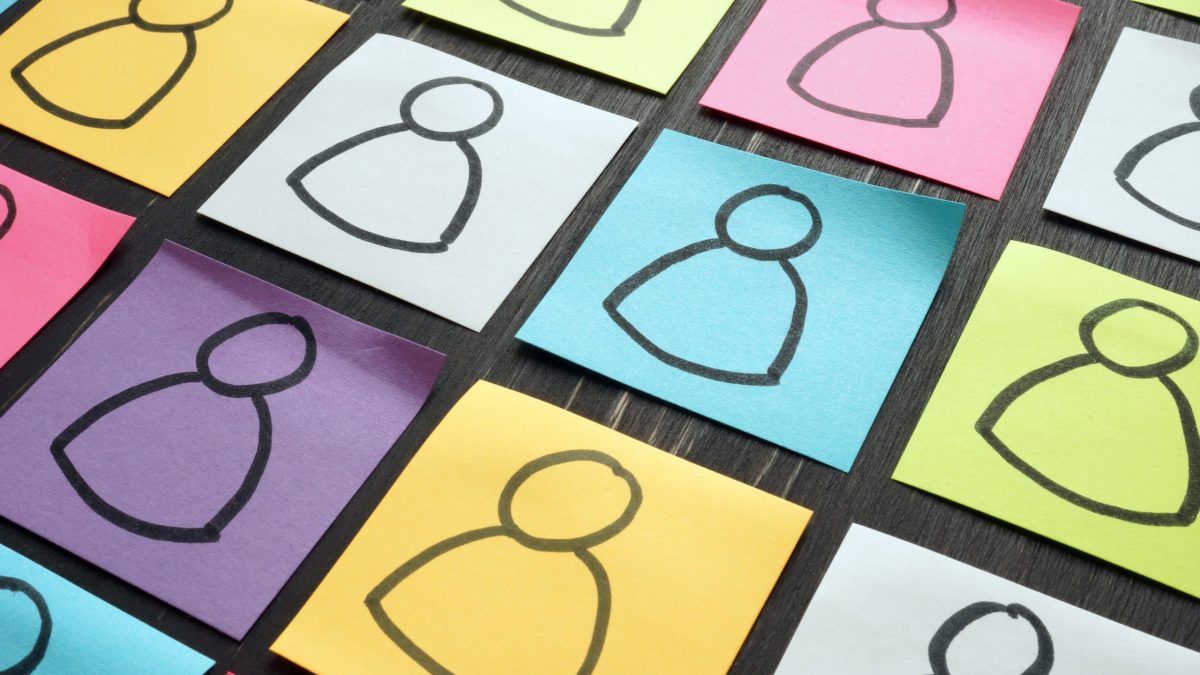 Diversity and inclusion illustrated with colorful sheets.