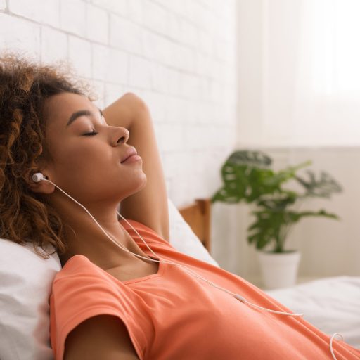 Women relaxes while listening to music.