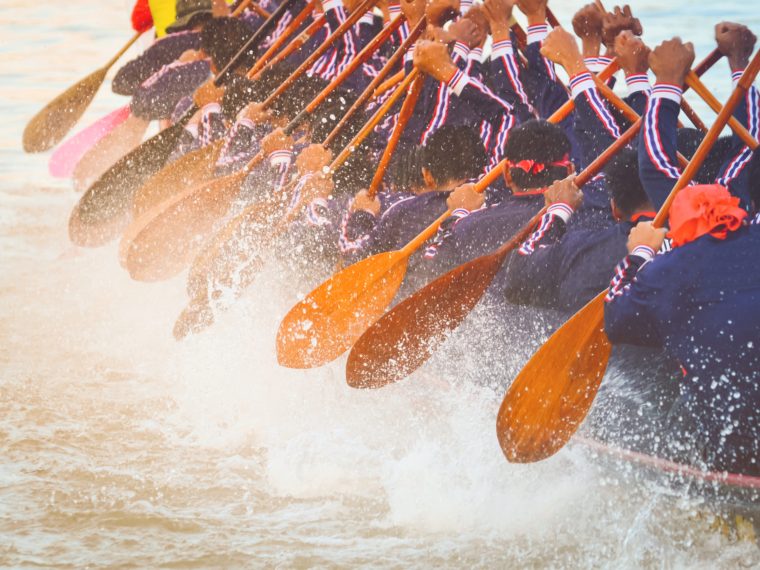 Close up of rowing team race