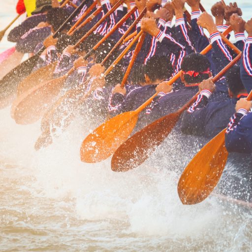 Close up of rowing team race