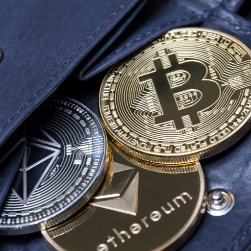 Cryptocurrency "coins" spilling out of a wallet.