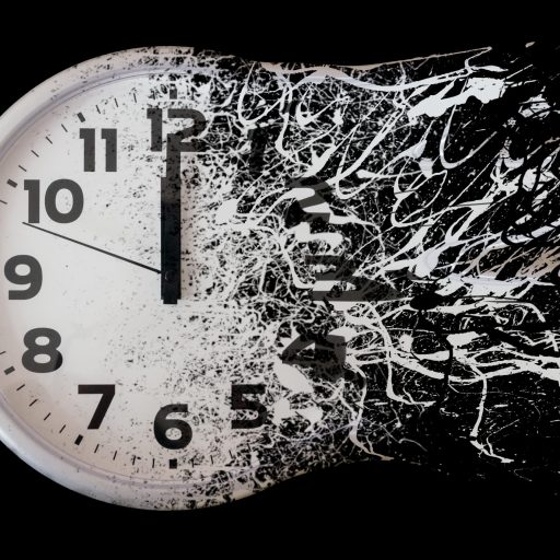 An analog clock dissolves against a black background.