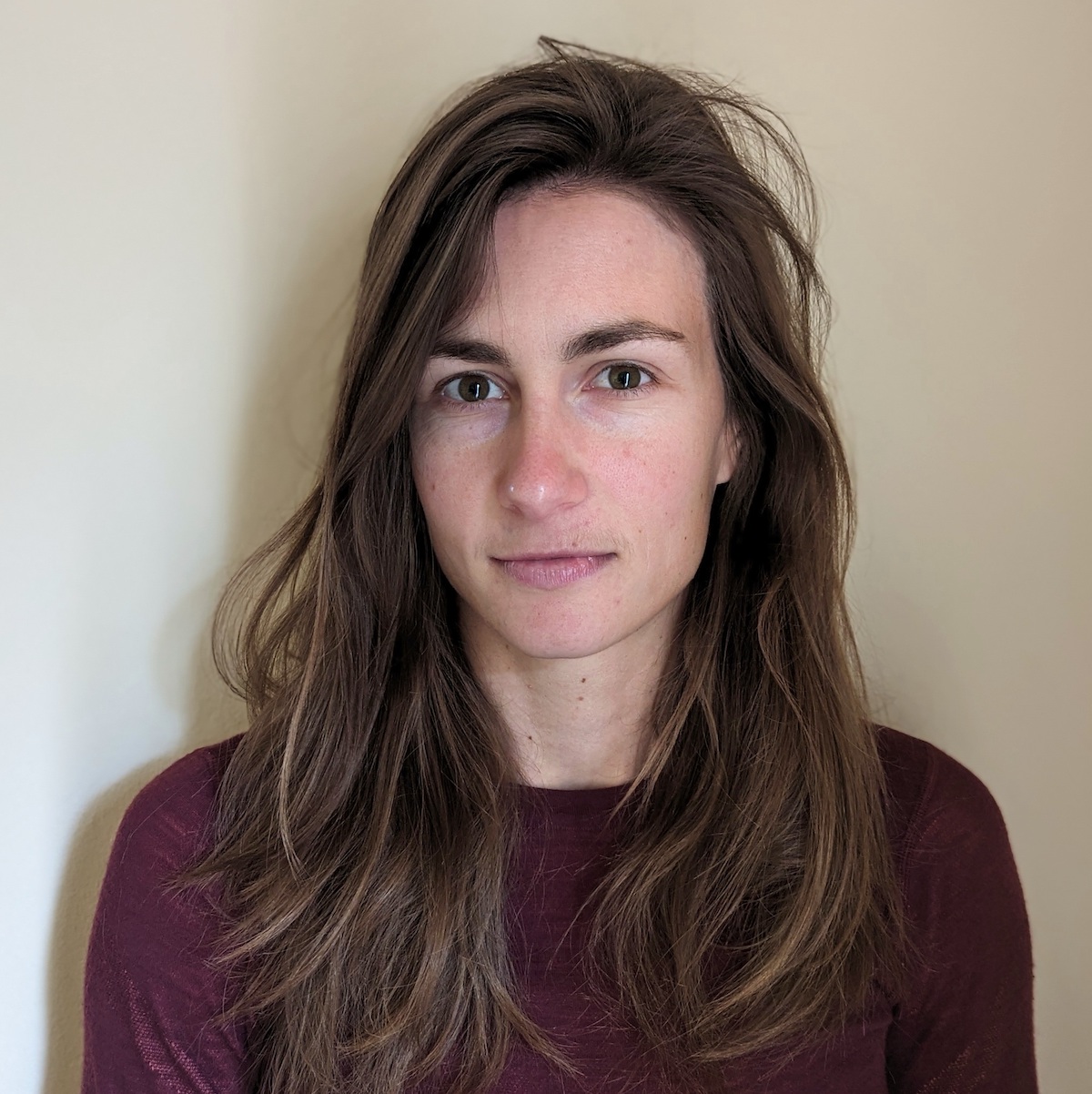 a close up of a person with long hair.