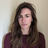 a close up of a person with long hair.
