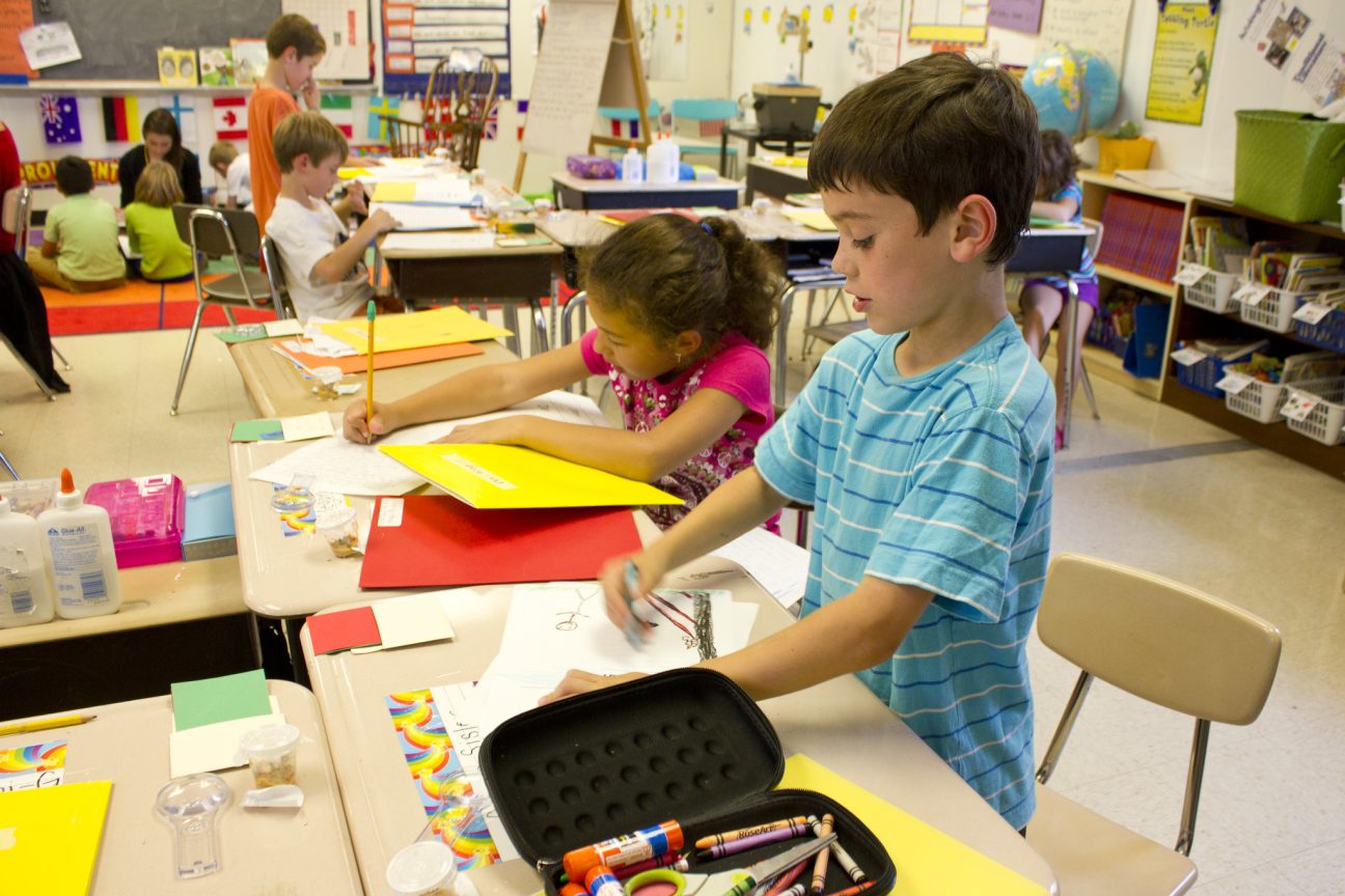 Two second graders learn by different approaches. One draws a picture, the other writes a paragraph.