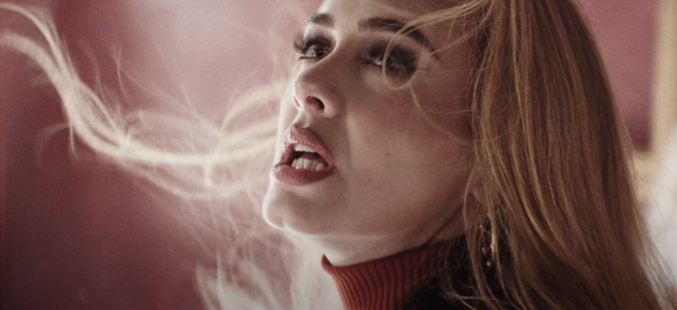 Adele singing; why sad songs make us feel good.