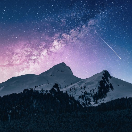 Shooting star over a mountain range