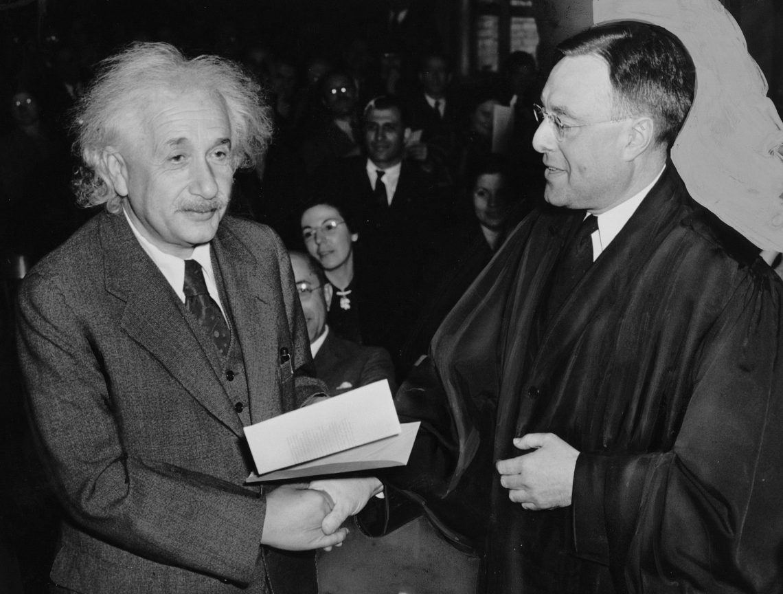Albert Einstein receives his certificate of American citizenship.