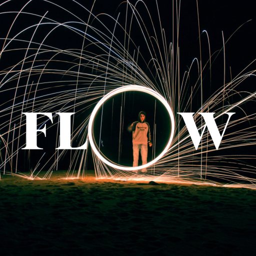 A person stands inside a glowing circle with sparks flying around in arcs, capturing the essence of "What is flow state," as the word "FLOW" appears in bold white letters across the center.