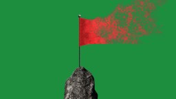 A red flag on top of a gray rock, with the right side dissolving into particles—like automatic habits breaking apart—set against a solid green background.