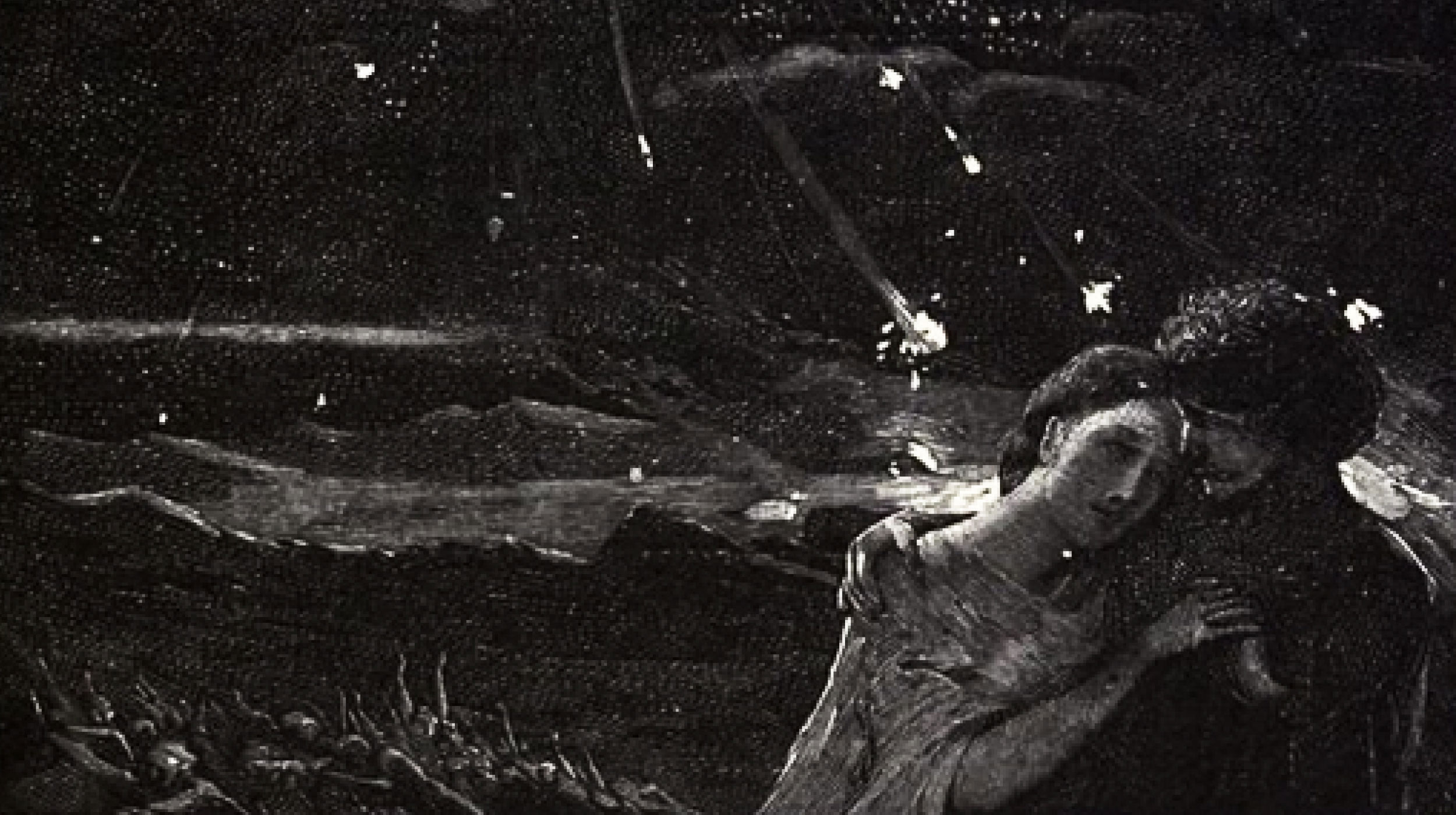 Two figures embrace in the foreground as celestial bodies or stars, evoking supernatural thinking, tumble from a dark sky; in the background, a crowd with raised arms watches in awe.