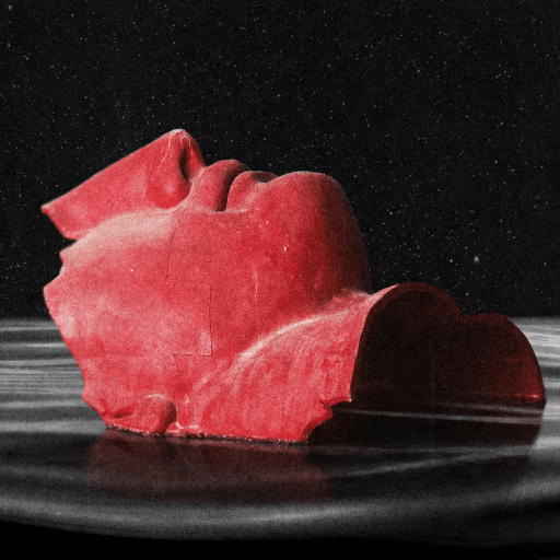 A red, fragmented sculpture of a human face is partially submerged in dark, rippling water against a black background.