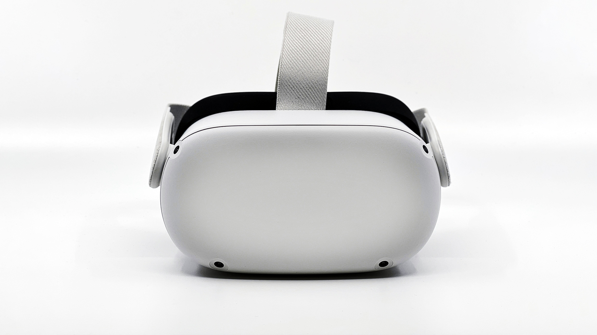 A white virtual reality headset on a white background.