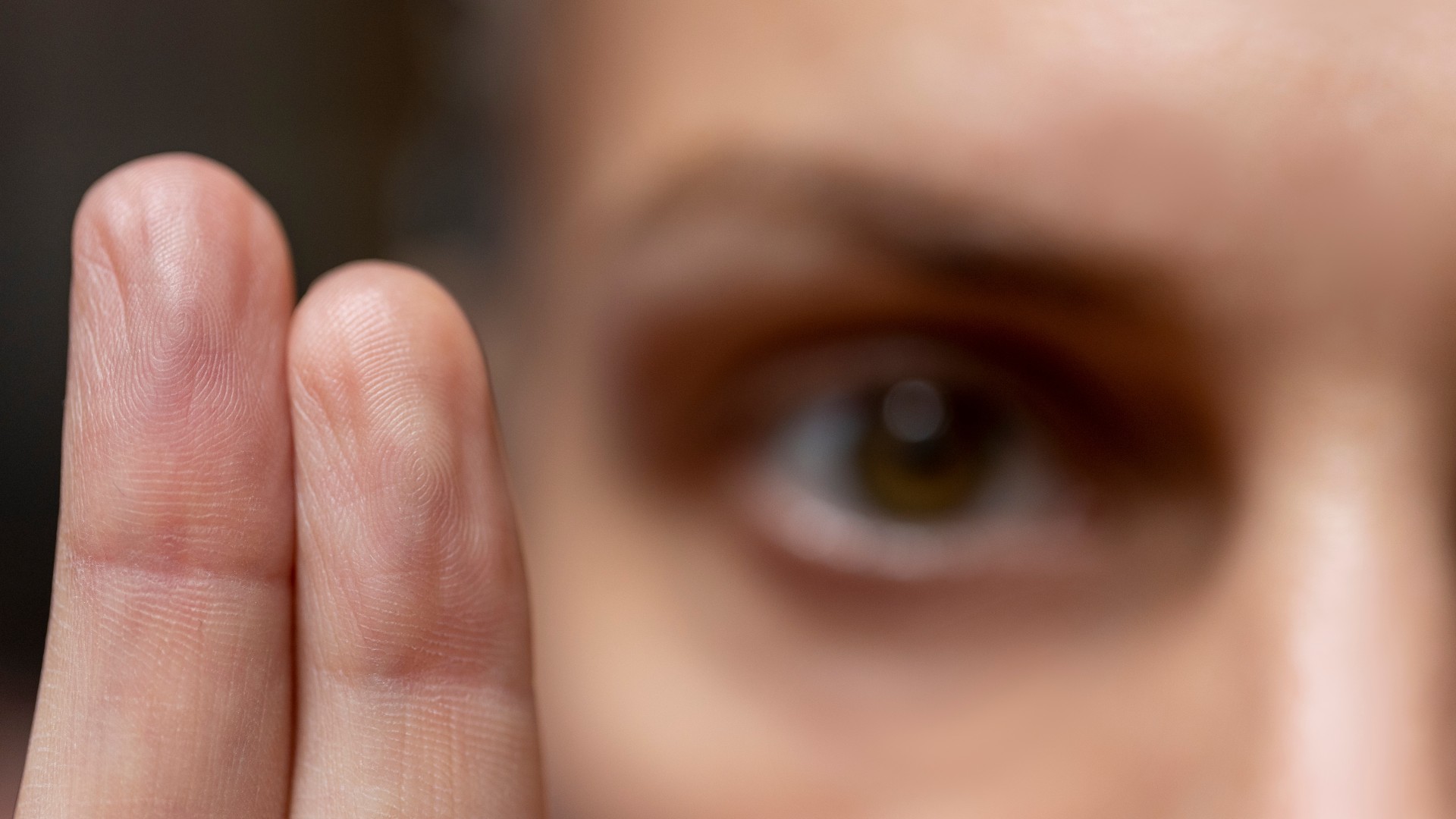 A PTSD patient follows a therapist's finger during EMDR treatment.