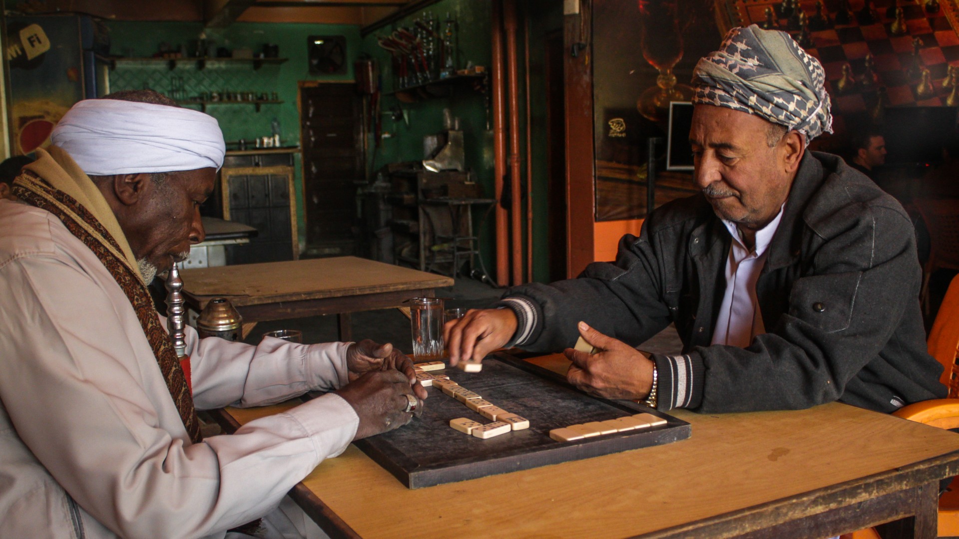Two long-time friends play dominoes in Egypt