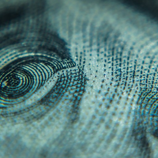 a close up of a blue dollar bill.