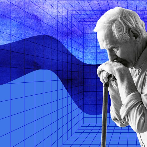 a man holding a microphone in front of a blue background.