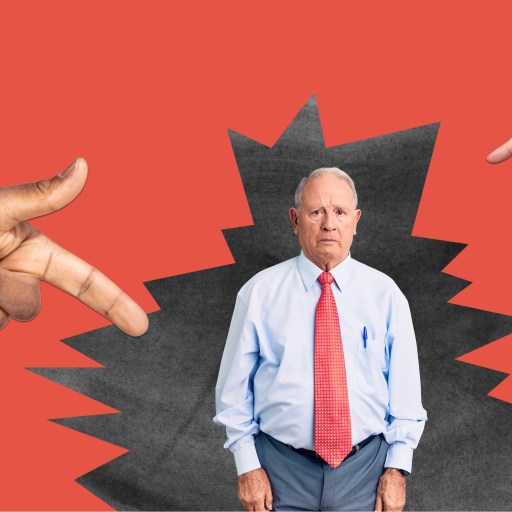 a man in a red tie and a hand pointing at him.