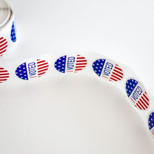 a roll of patriotic ribbon on a white surface.