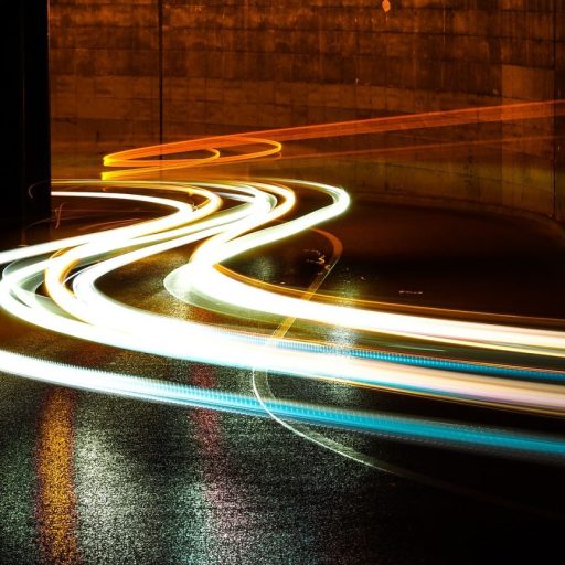 a blurry photo of a city street at night.