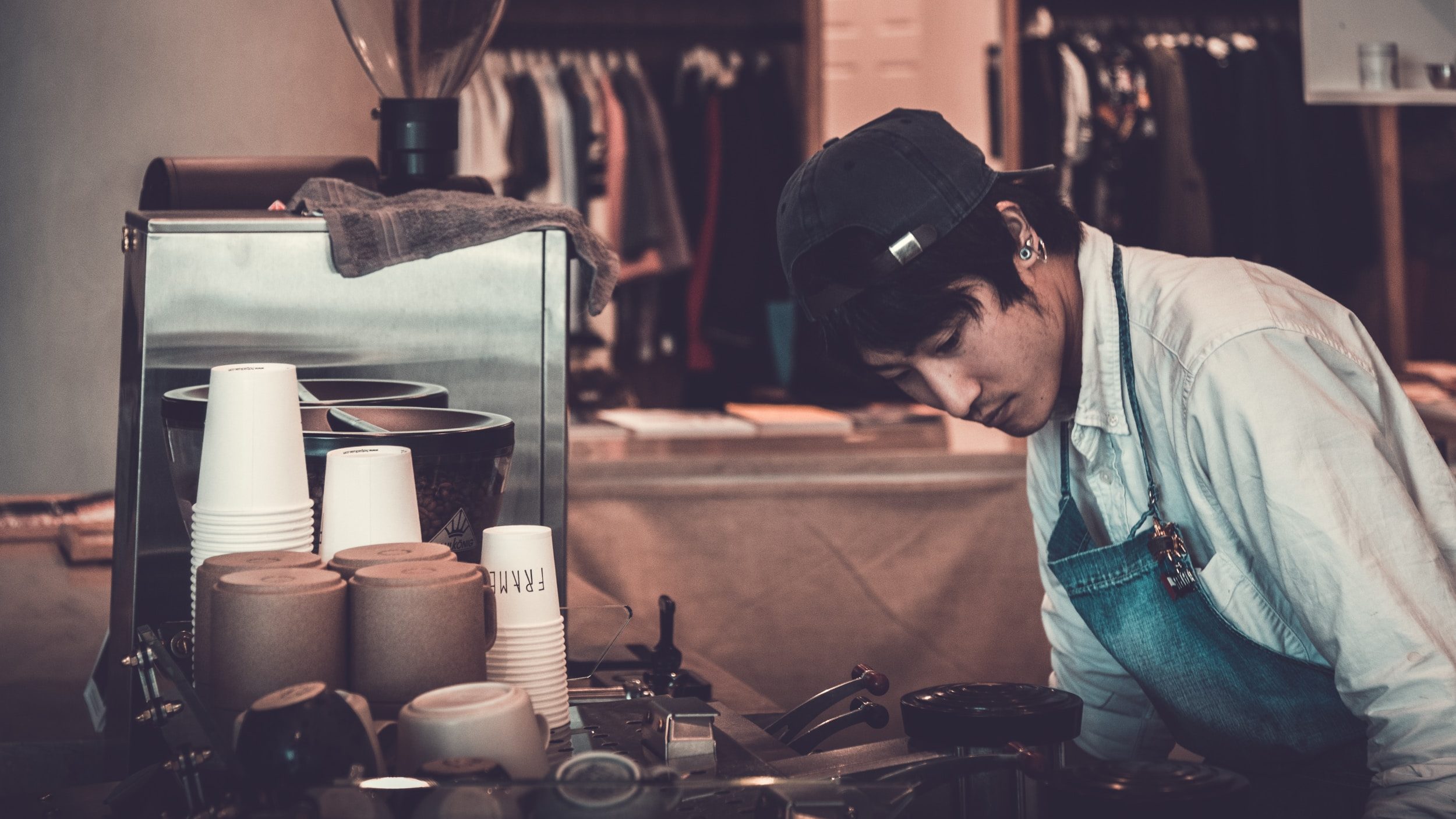 A man working on a machine in a shop.