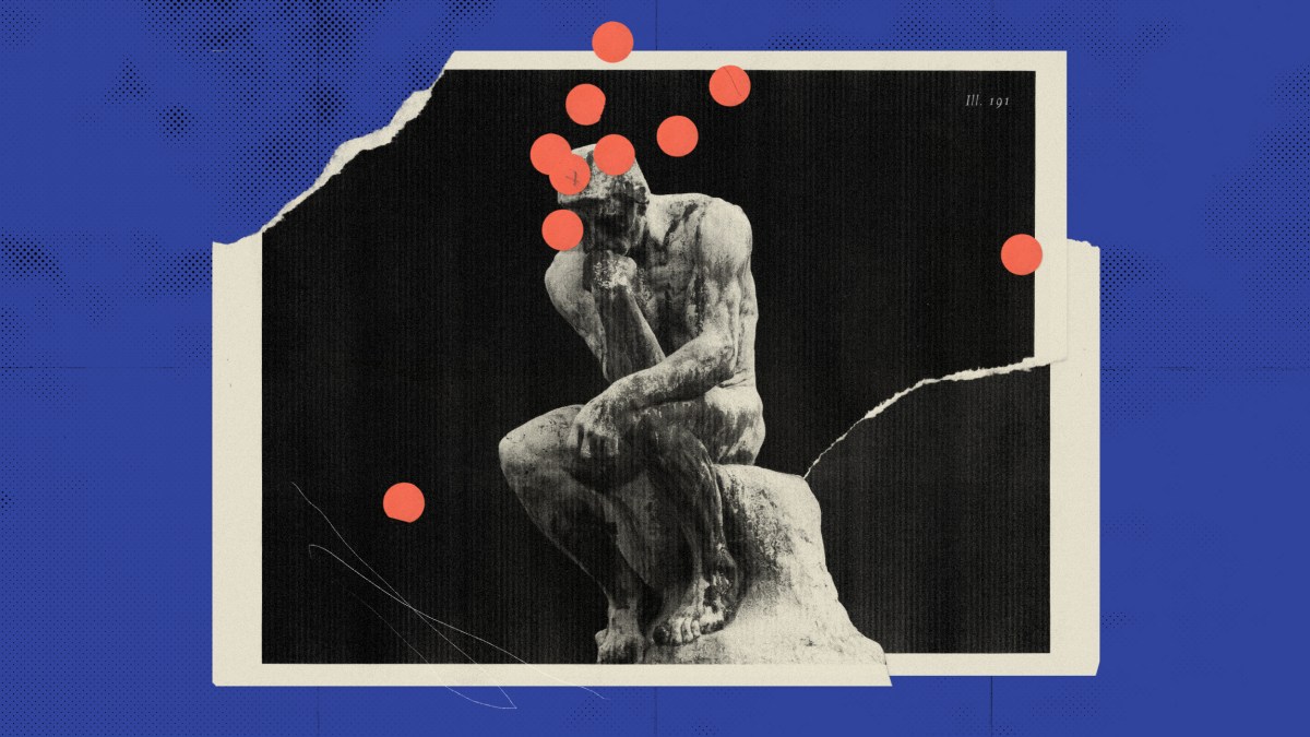 a black and white photo of a man sitting on a rock.