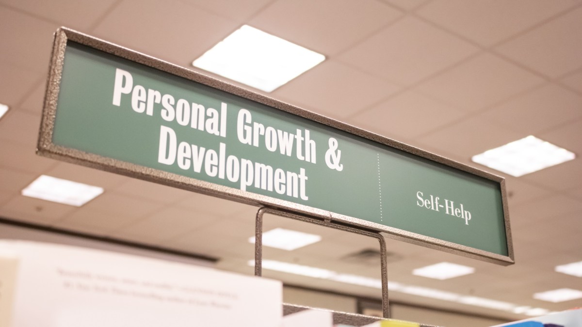 a sign that says personal growth and development.