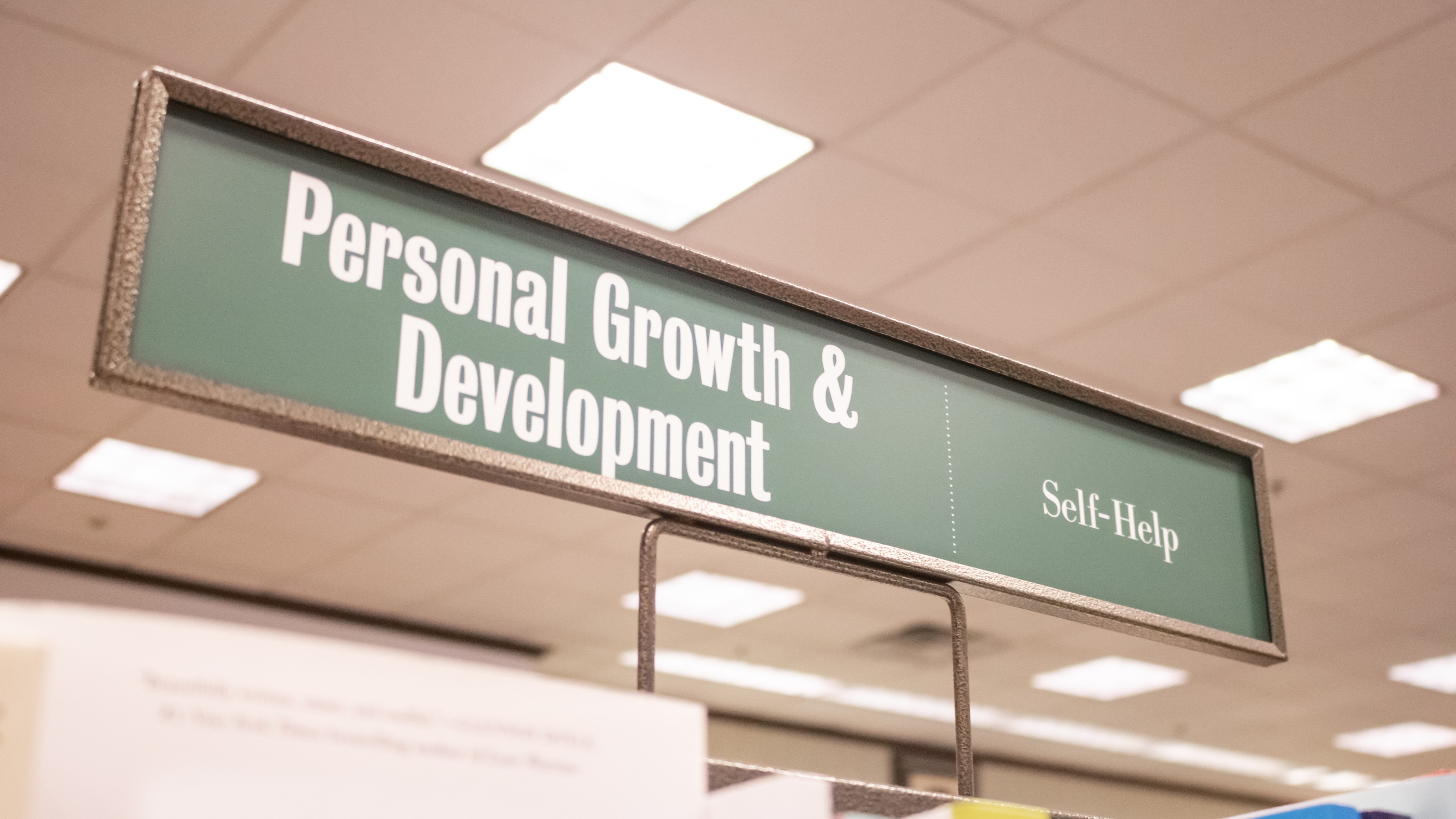 a sign that says personal growth and development.