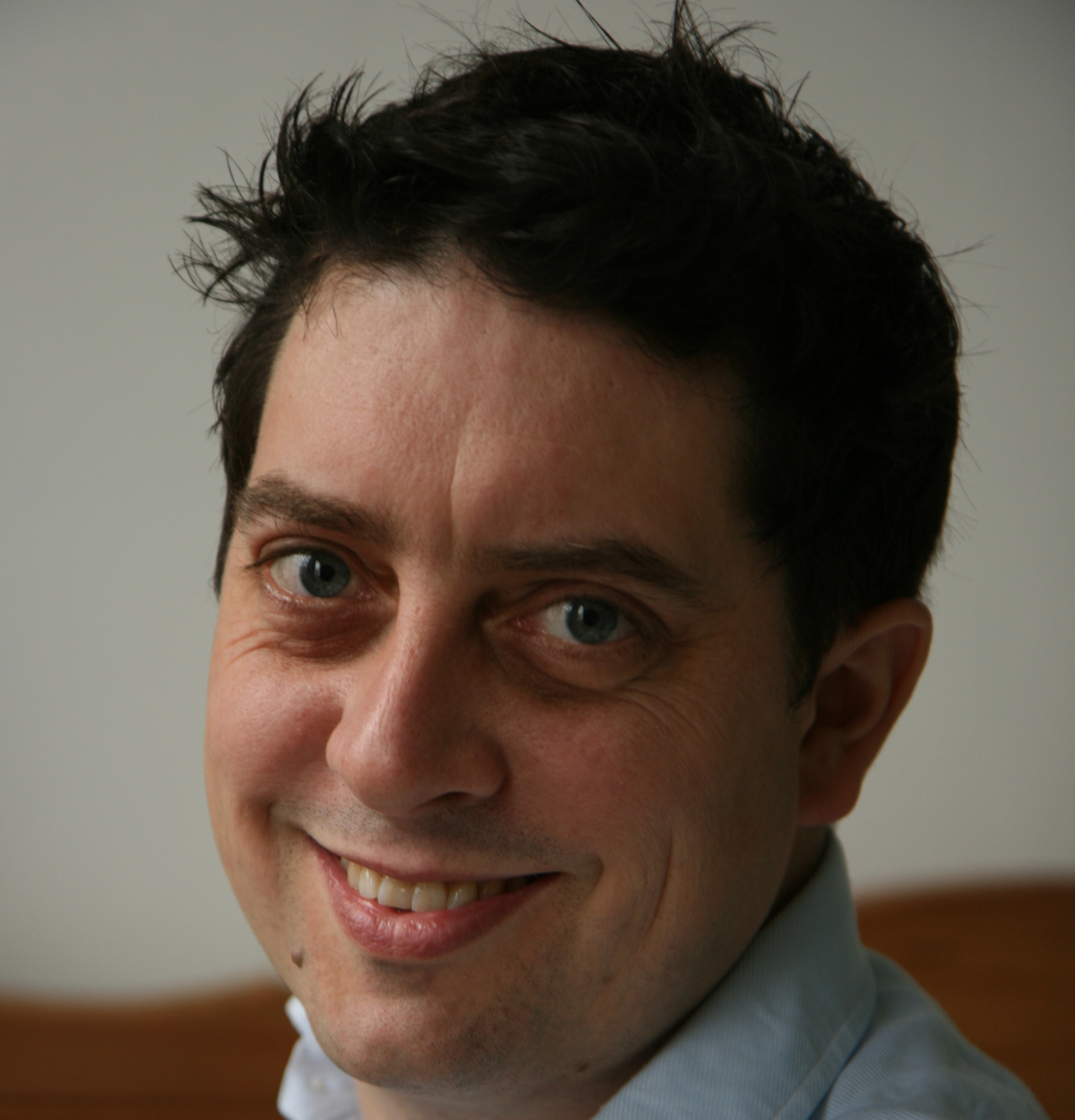 a close up of a person wearing a shirt and tie.