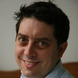 a close up of a person wearing a shirt and tie.