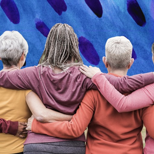 a group of women standing next to each other.