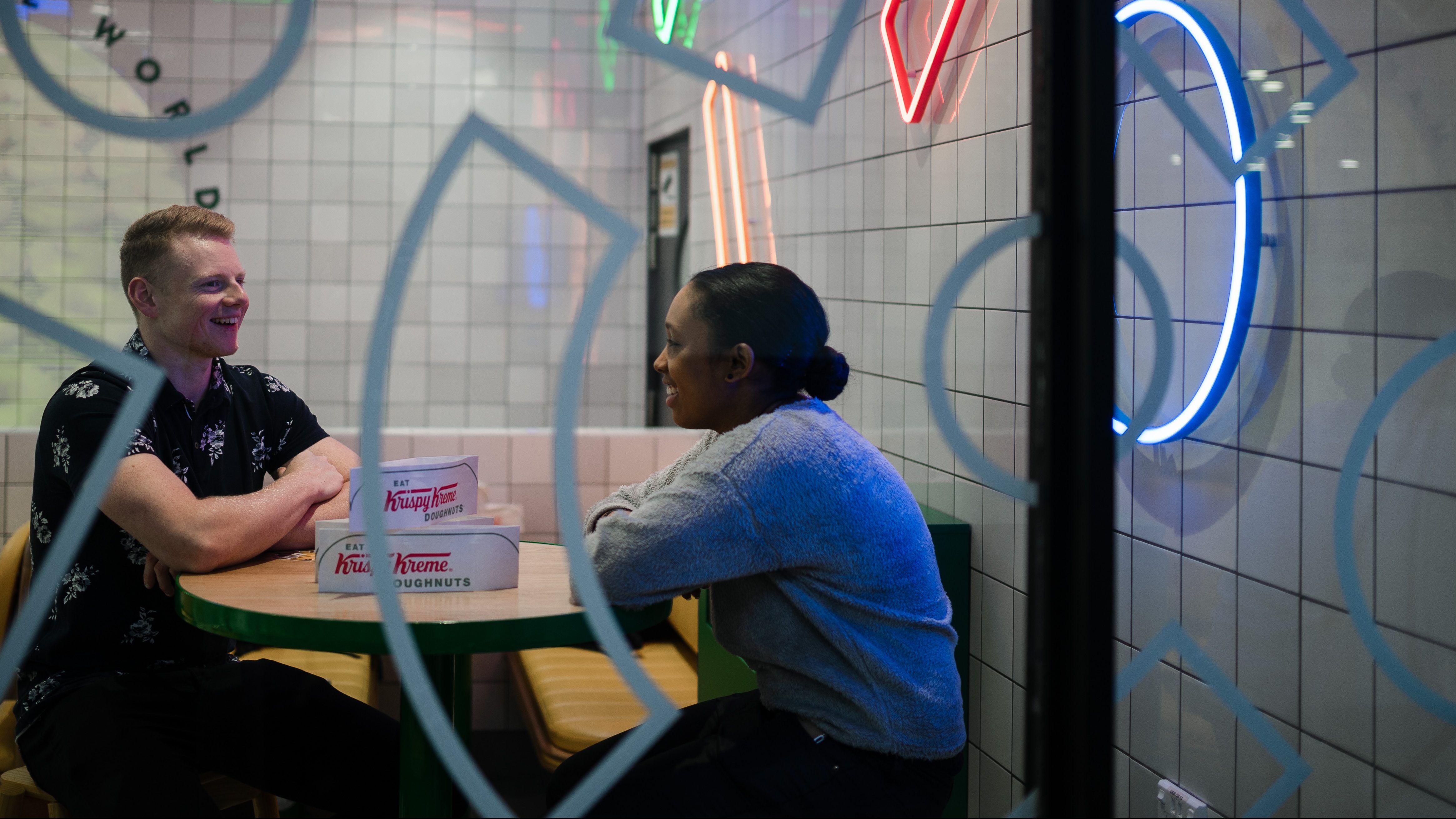 A man and a woman sitting at a table.