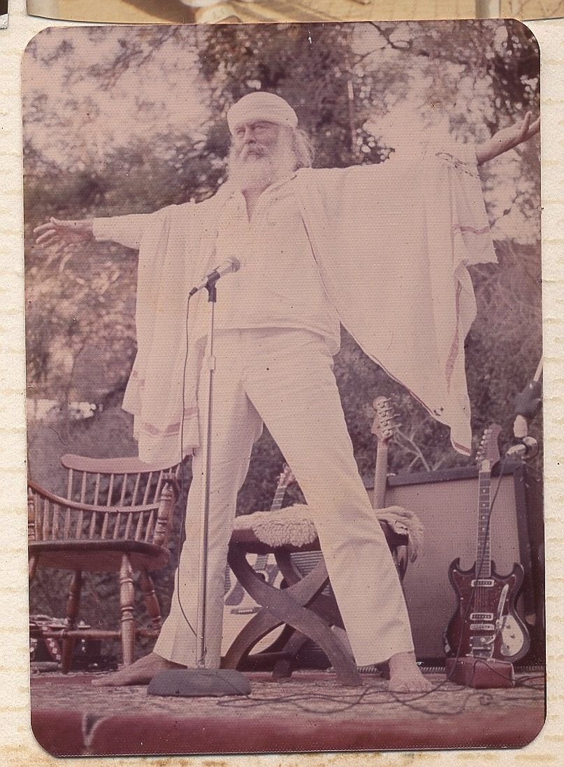 an old photo of a man singing into a microphone.