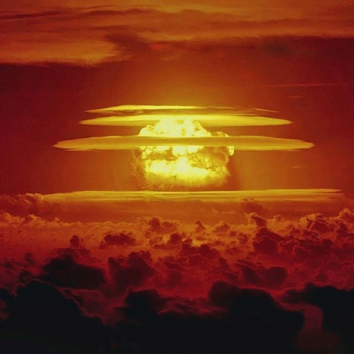 a large group of clouds with a red sky in the background.