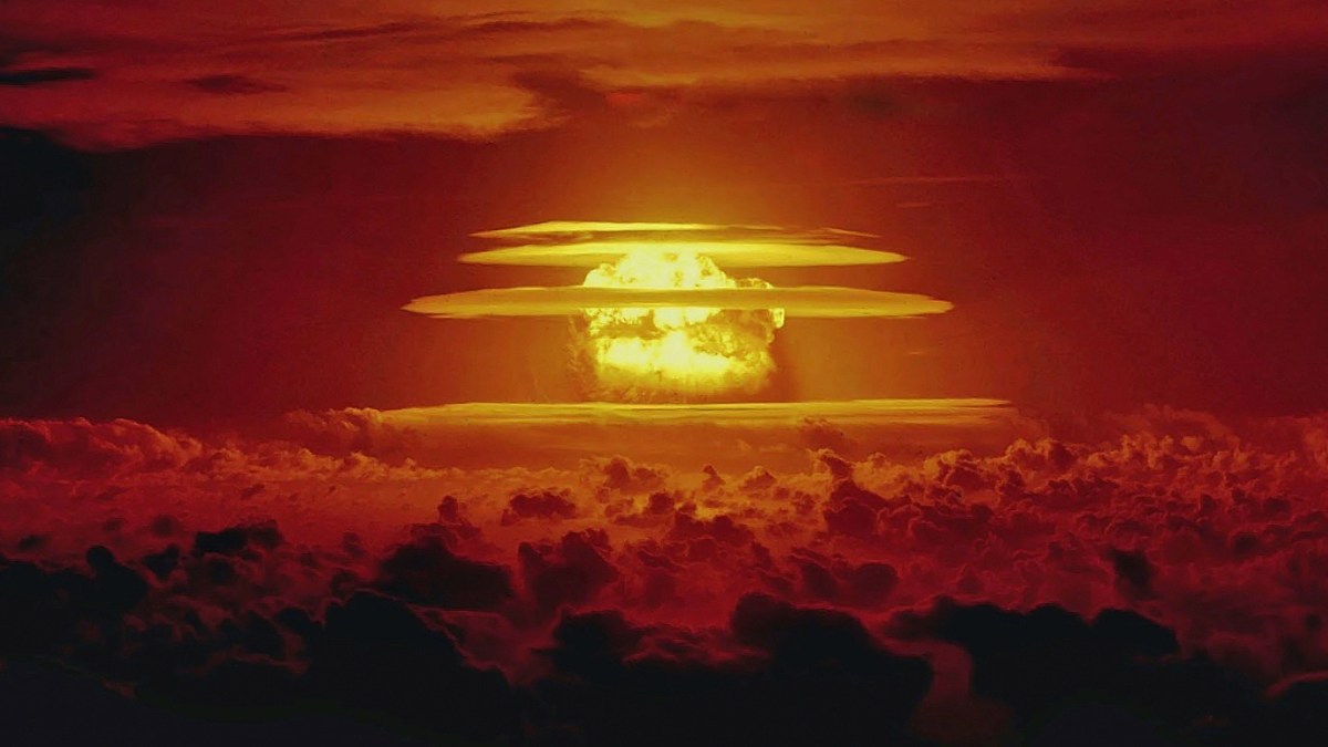 a large group of clouds with a red sky in the background.