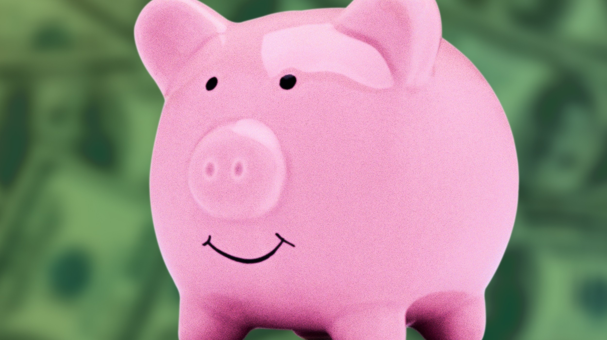a pink pig with a smile on its face.