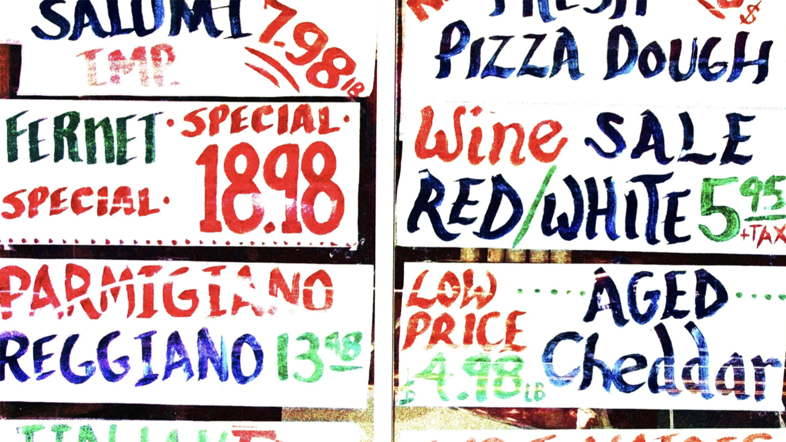 a bunch of signs that are on the side of a building.