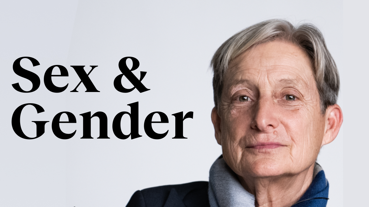 a woman with grey hair and a blue jacket.