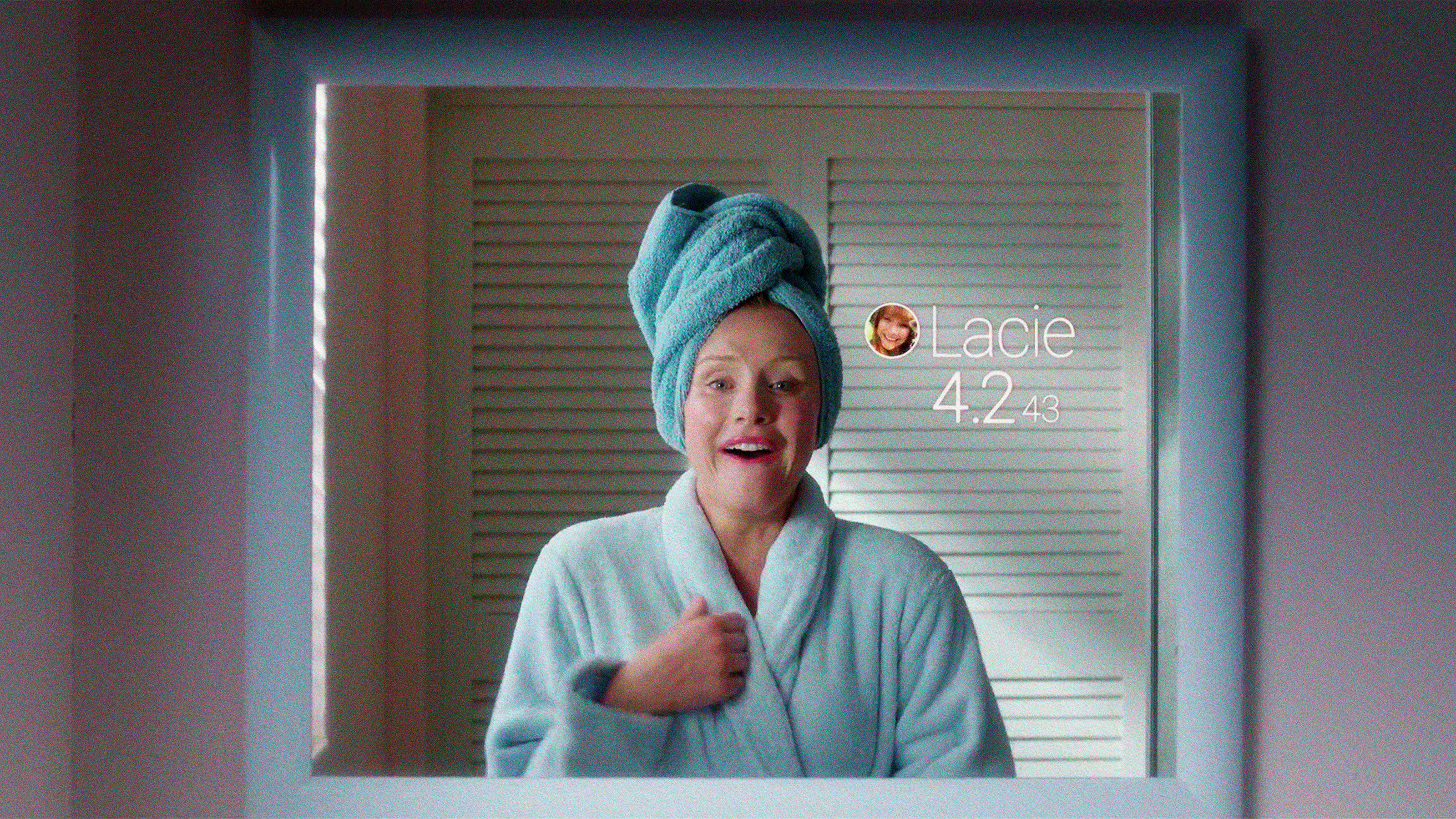 a woman with a towel wrapped around her head.