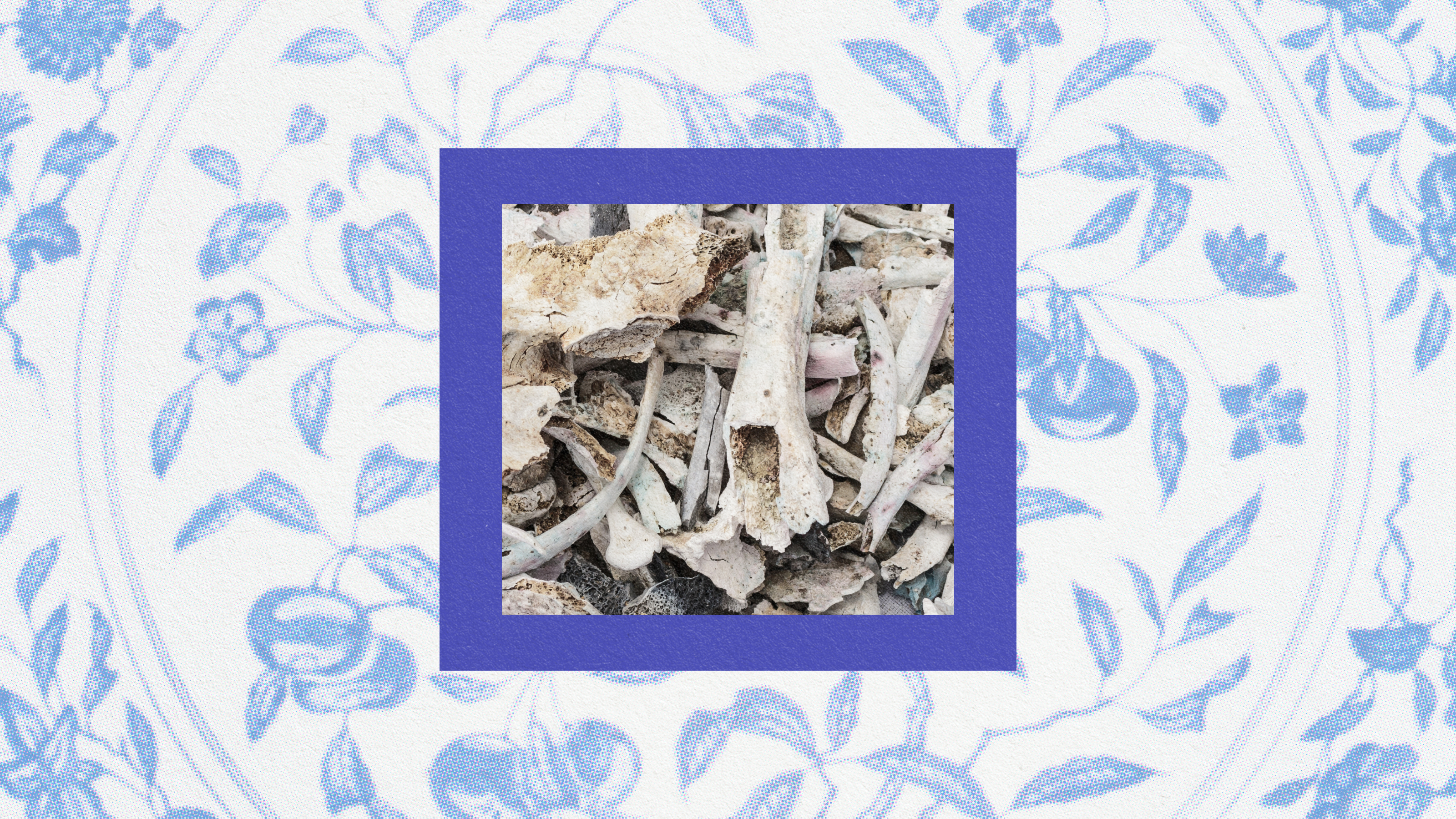 a blue and white porcelain frame with a picture of a piece of wood.