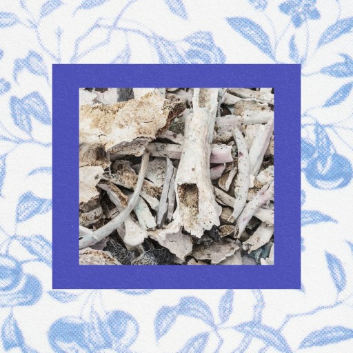 a blue and white porcelain frame with a picture of a piece of wood.