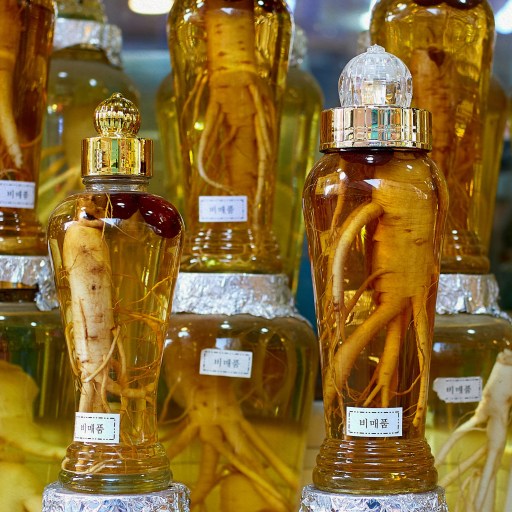a row of traditional chinese medicine bottles with different kinds of oil in them.