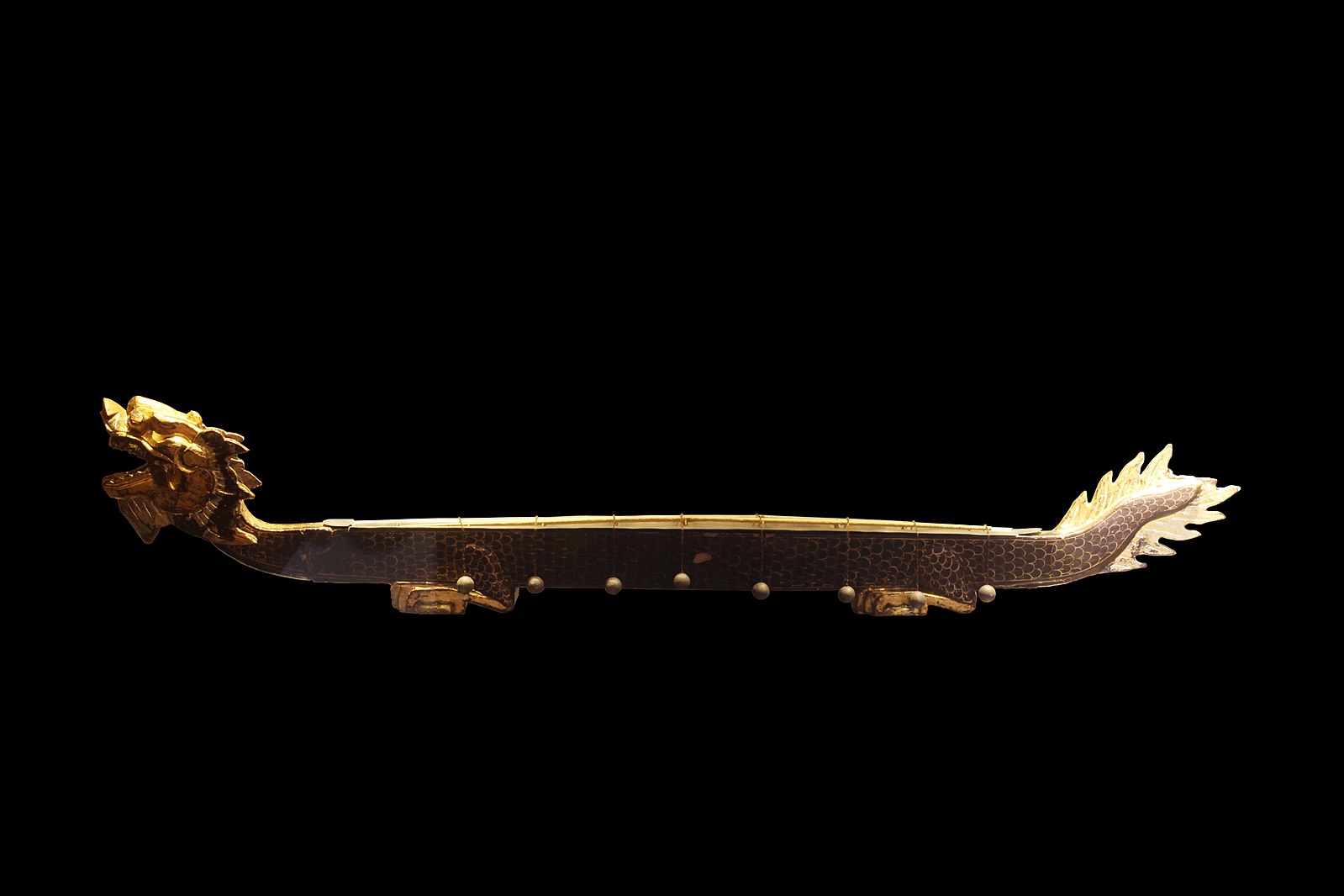 A gold dragon on a black background.