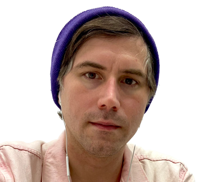 a man wearing a purple beanie and earphones.