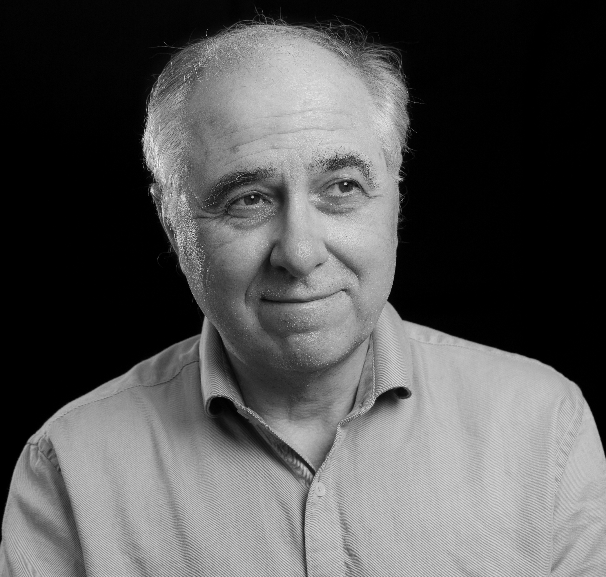 a black and white photo of an older man.
