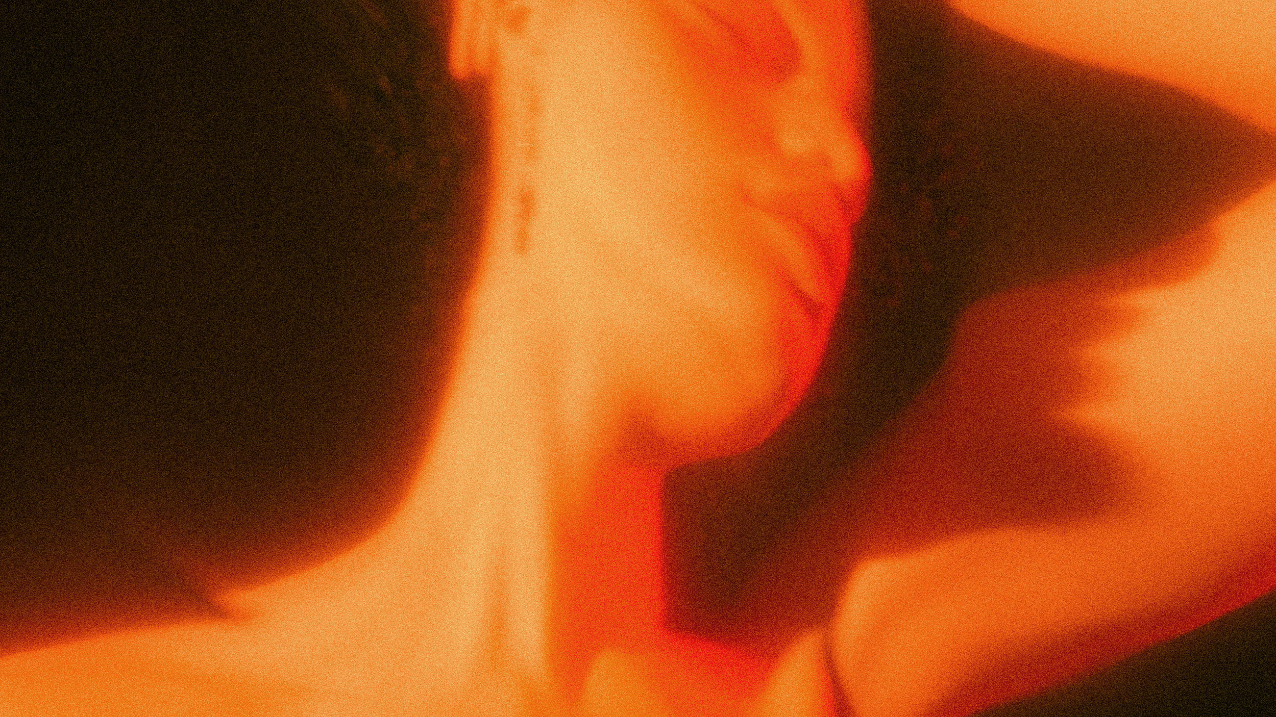 A woman experiencing a near-death event with her head uplifted.