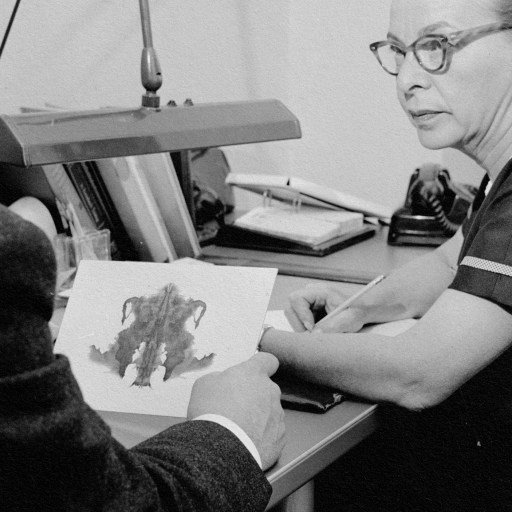 A vintage photo portraying a woman engaged in predictive processing while studying a document.